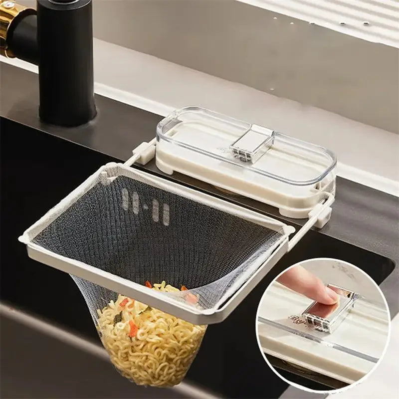 Kitchen sink filter rack with mesh strainer bags featuring a white plastic and clear acrylic sink-mounted noodle strainer with mesh basket holding cooked noodles.