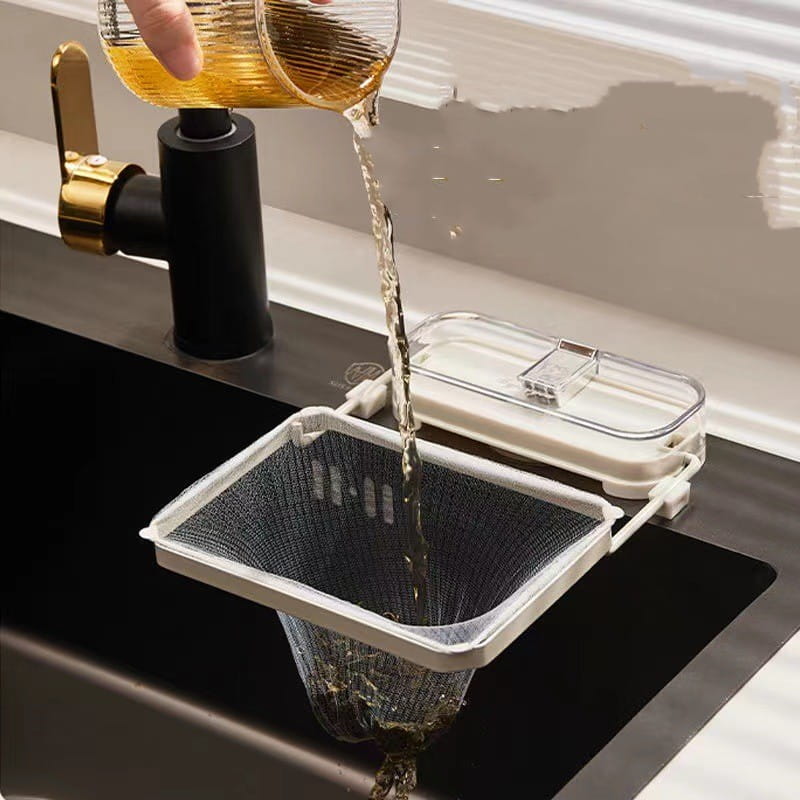 Kitchen sink filter rack with white plastic frame and black mesh strainer bags suspended over a sink for filtering liquids during cooking or cleaning.