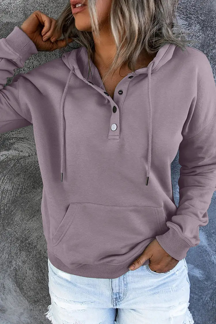 A soft lavender-colored women’s hooded sweatshirt made of comfortable material featuring a button-front placket and matching drawstrings.