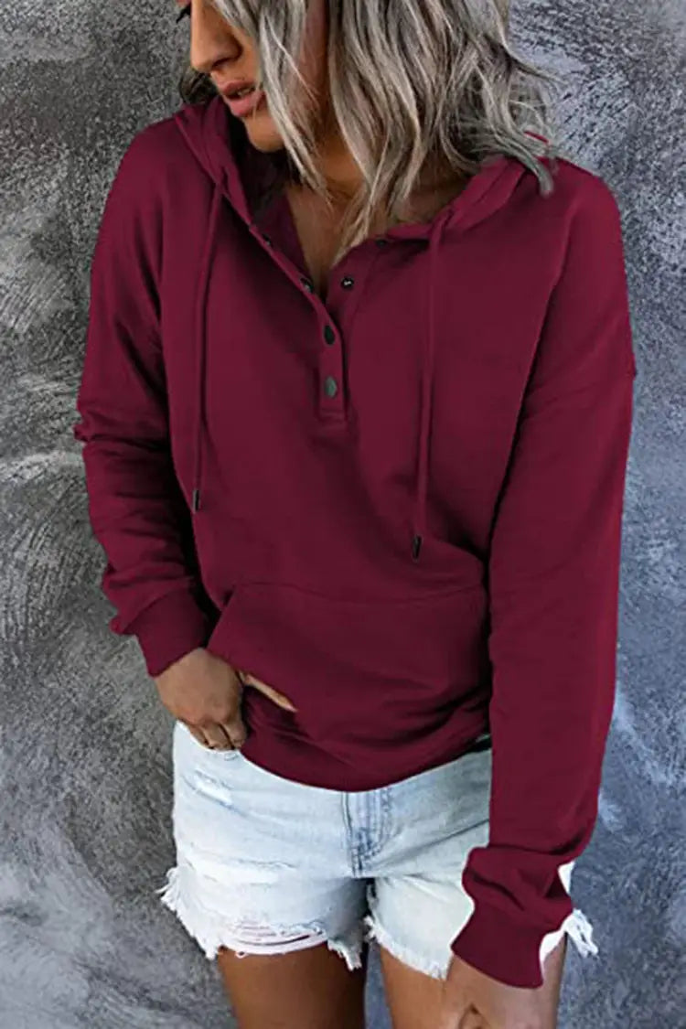 Women’s maroon long-sleeved button neck drawstring hooded sweatshirt featuring a henley-style front placket designed for casual wear.