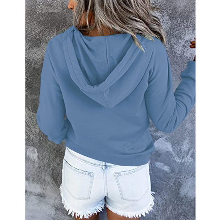 A soft blue women’s button neck long-sleeved hoodie with a relaxed fit and drawstring hood.