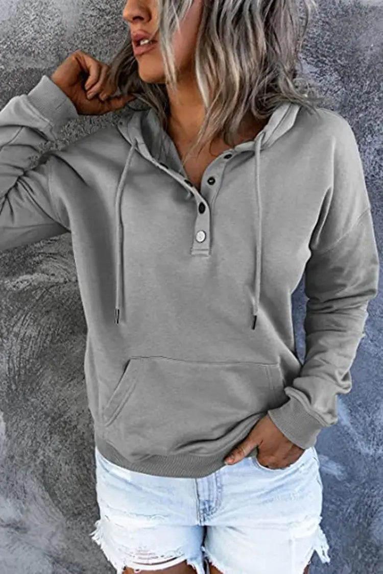 Gray hooded sweatshirt for women with a button-front placket and front pocket made of soft fabric for casual wear.
