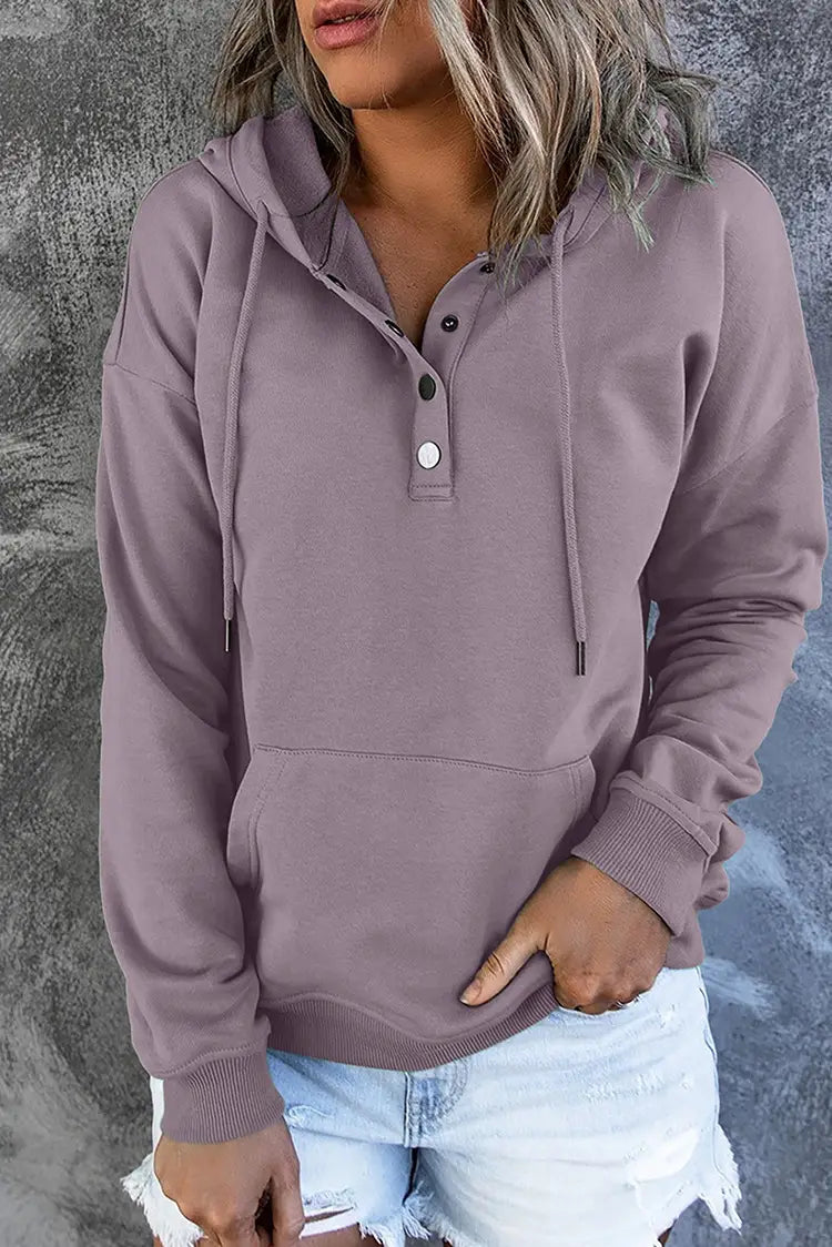 A soft mauve-colored women’s button neck drawstring hooded sweatshirt featuring a henley-style front and adjustable drawstrings.
