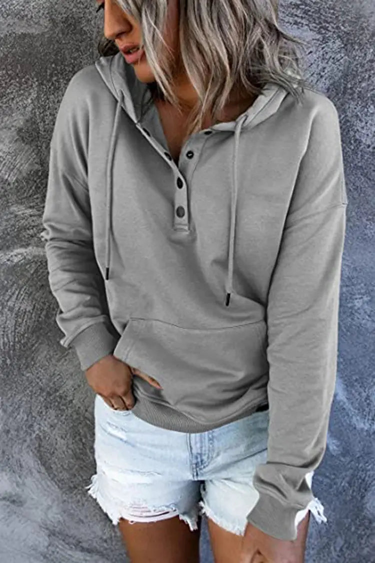 Gray women’s button neck drawstring hooded sweatshirt featuring a long-sleeved hoodie with buttoned placket and adjustable drawstring hood.
