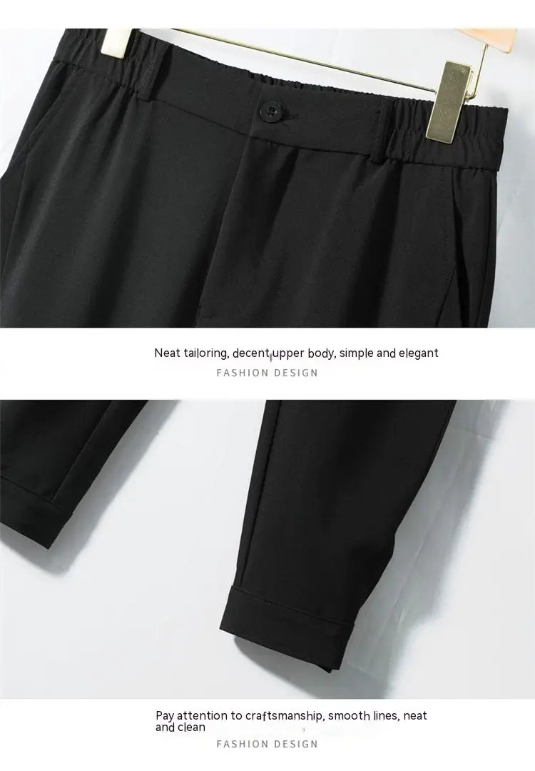 Men’s casual tapered jogger pants in black tailored fabric with sleek elegant design and neat stitching.