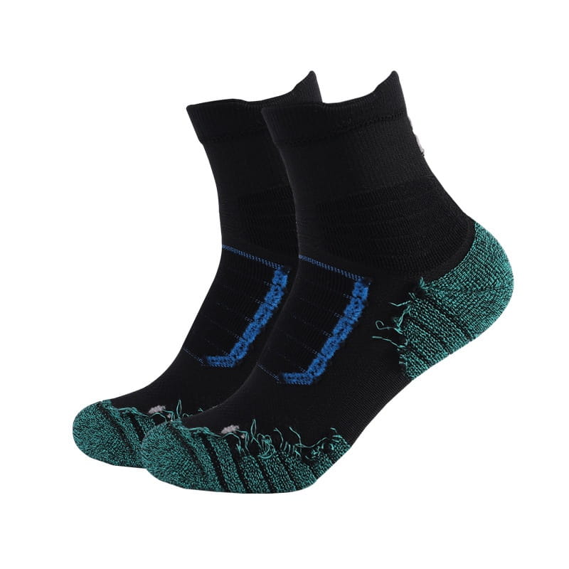 Athletic knee high sports socks in black with teal and blue accents featuring a textured toe and heel for enhanced grip.