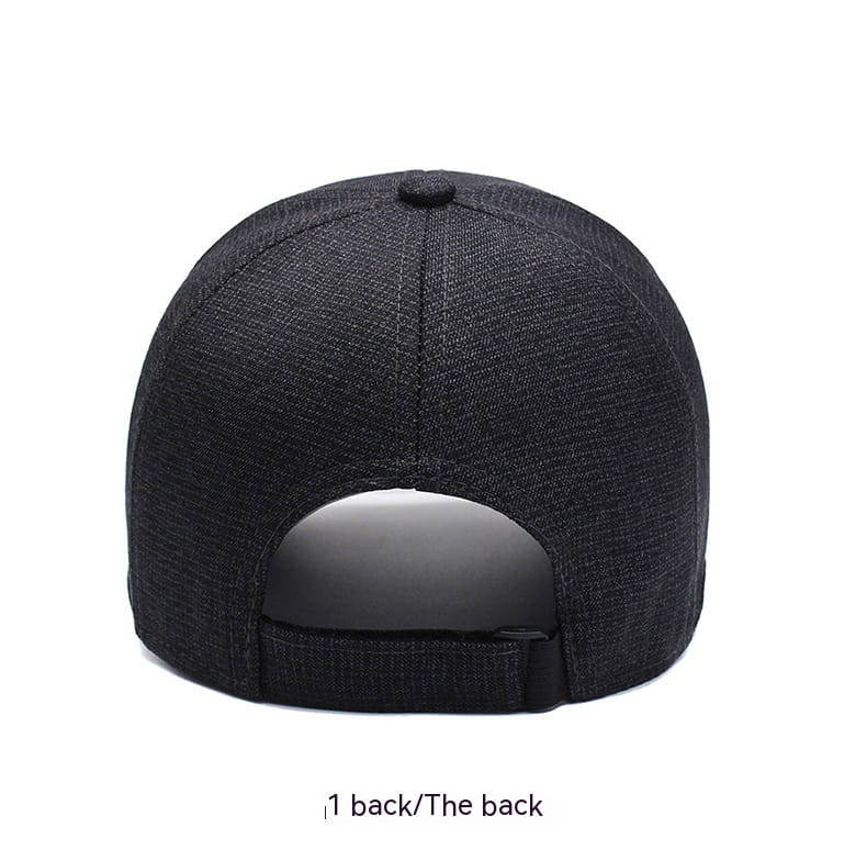 Black textured cotton baseball cap with leather patch and adjustable strap shown from the back side