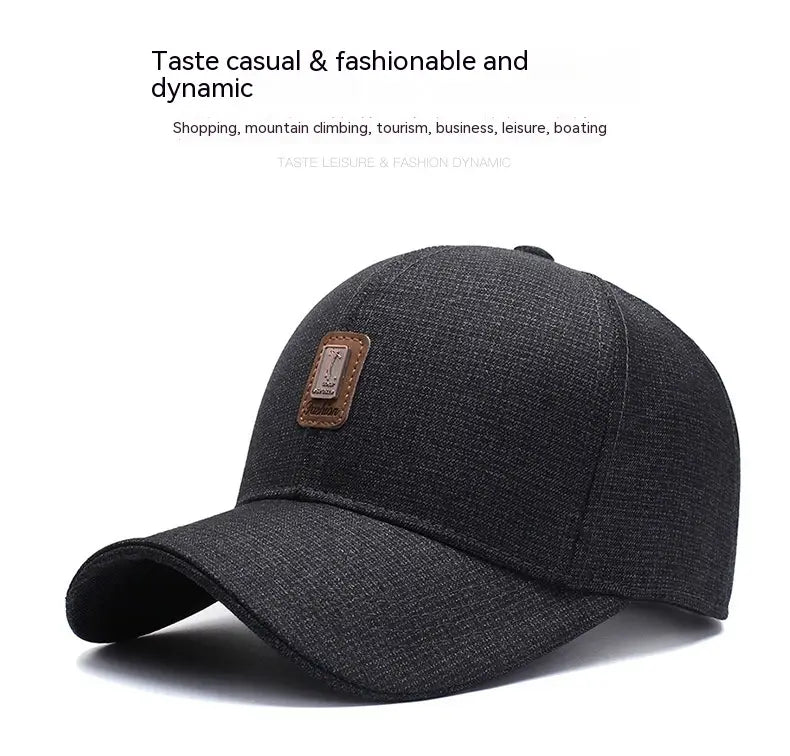 Black textured cotton baseball cap featuring a brown leather patch on the front designed for casual wear.