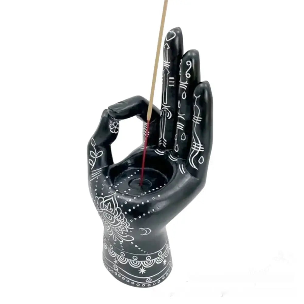 Black hand-shaped ceramic hamsa hand incense burner and candle holder figurine with intricate white decorative patterns