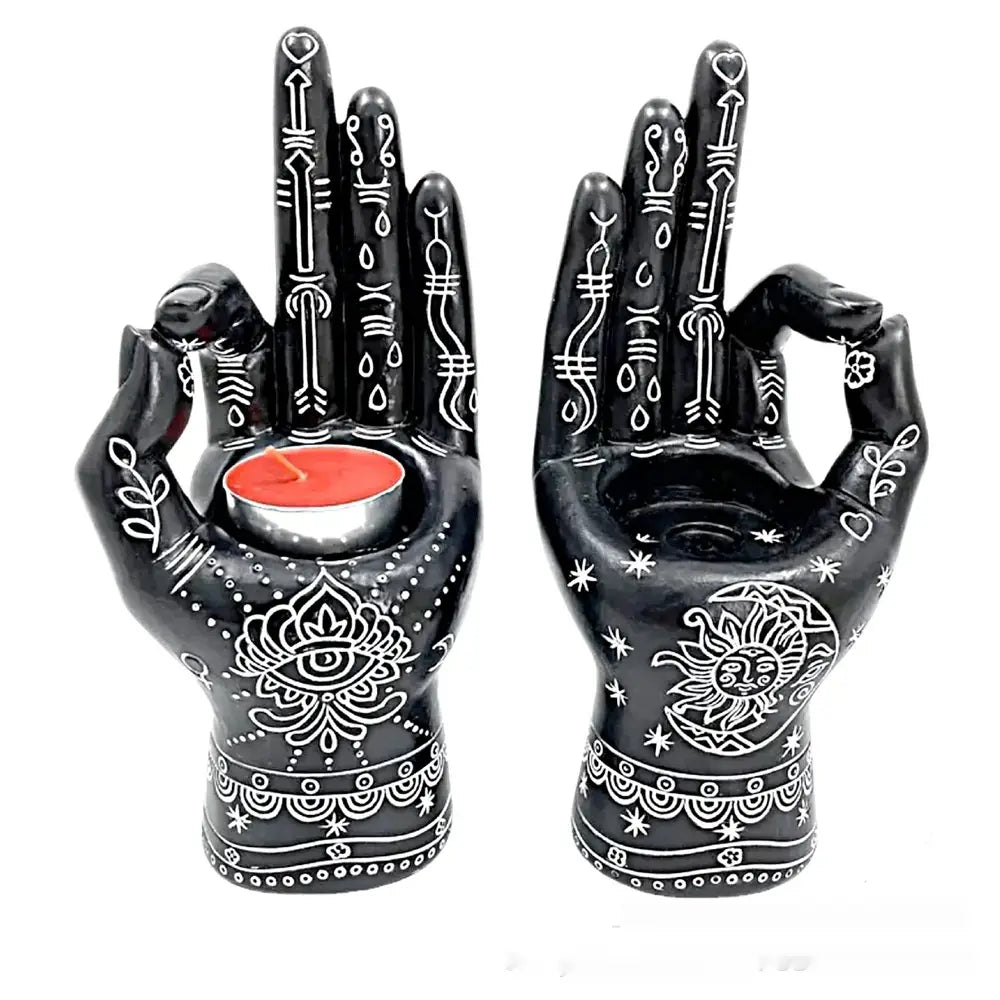 Black ceramic hamsa hand incense burner and candle holder figurine with intricate white henna-style designs and symbolic motifs.