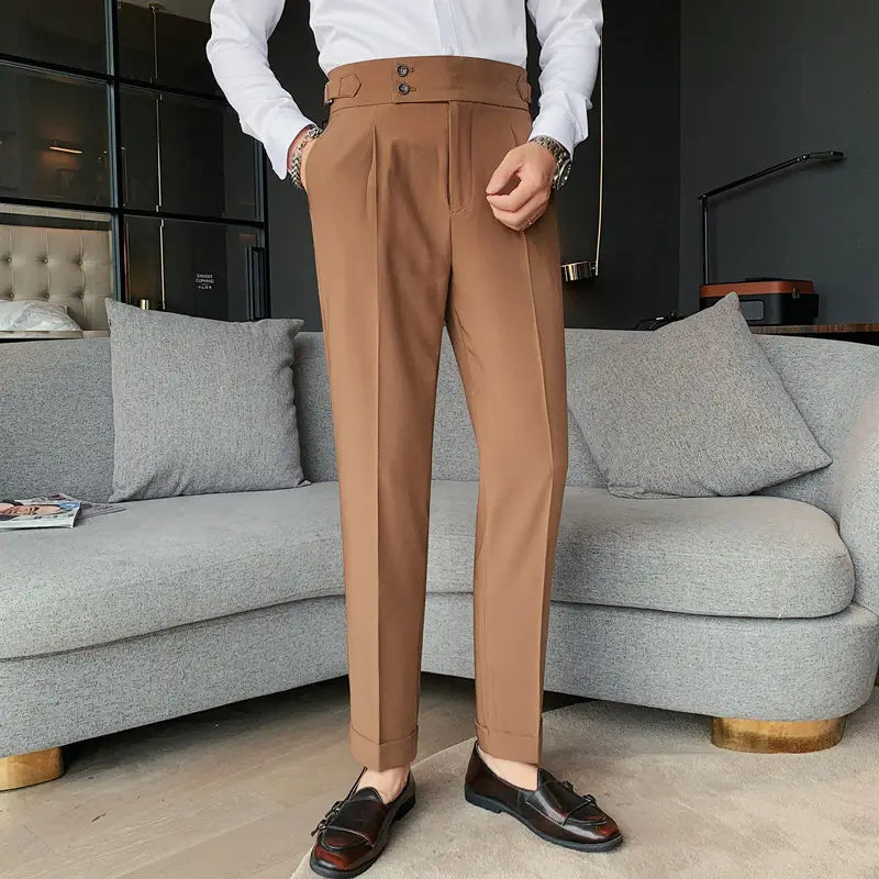 Brown slim solid color straight tailored trousers with a high waist pleated front and buttoned belt loops for men.