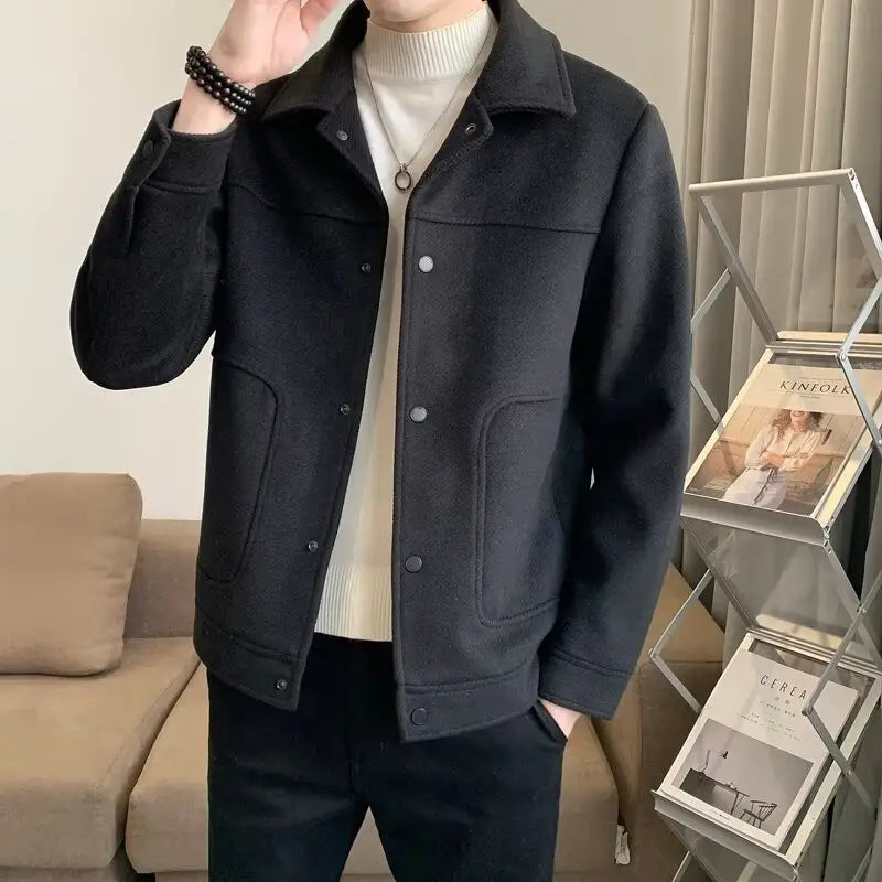 Black woolen coat with button closure featuring a classic collar for casual wear.