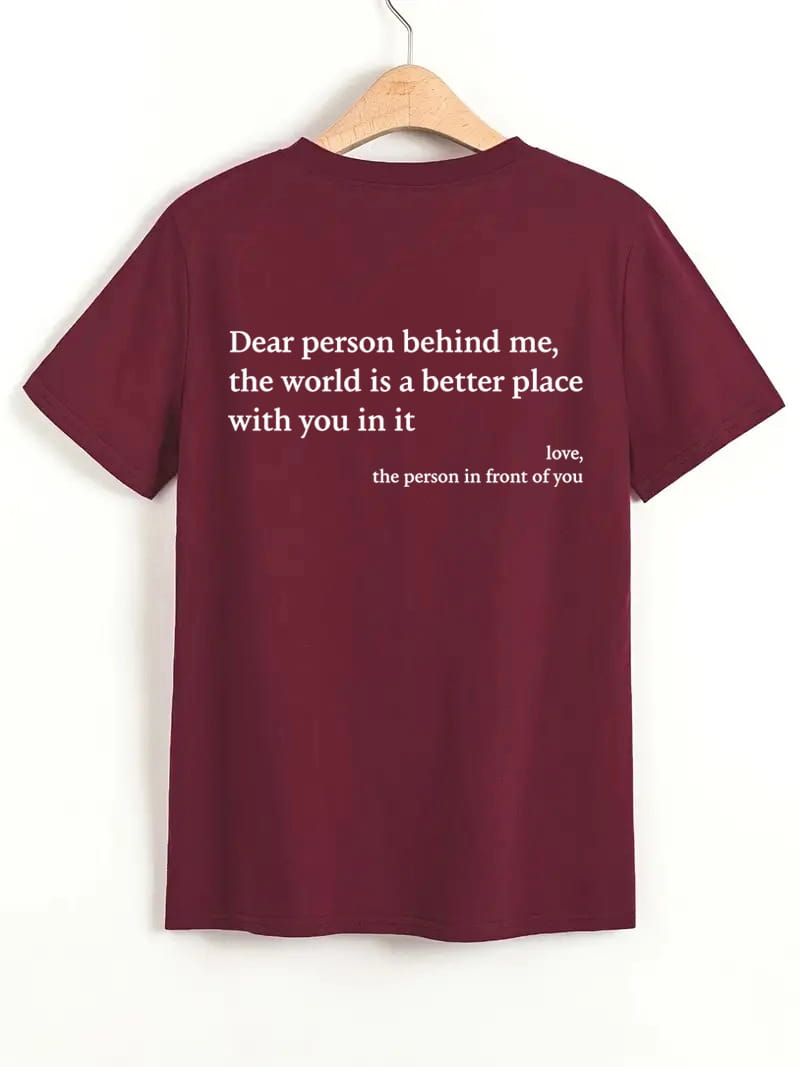 Back side of a maroon women’s oversized t-shirt featuring white slogan print and short sleeves.