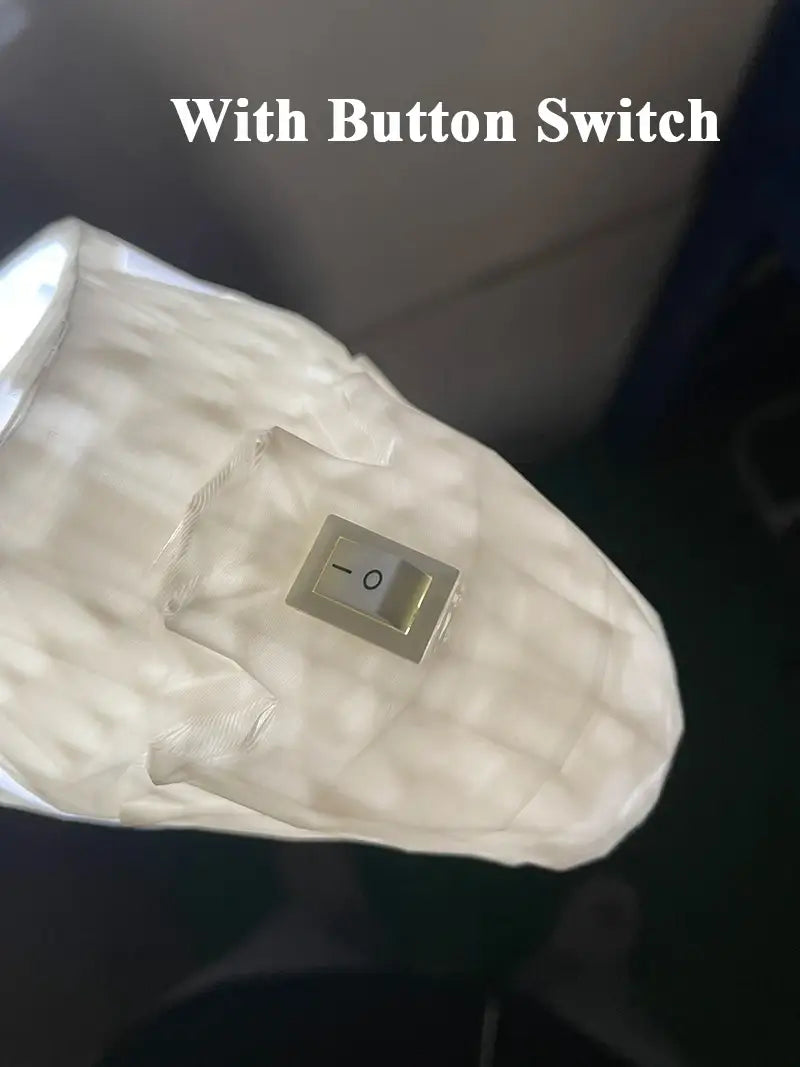 white textured fabric-covered button switch with metallic toggle and black markings on animal wall lamp 3d printed geometric sconce light