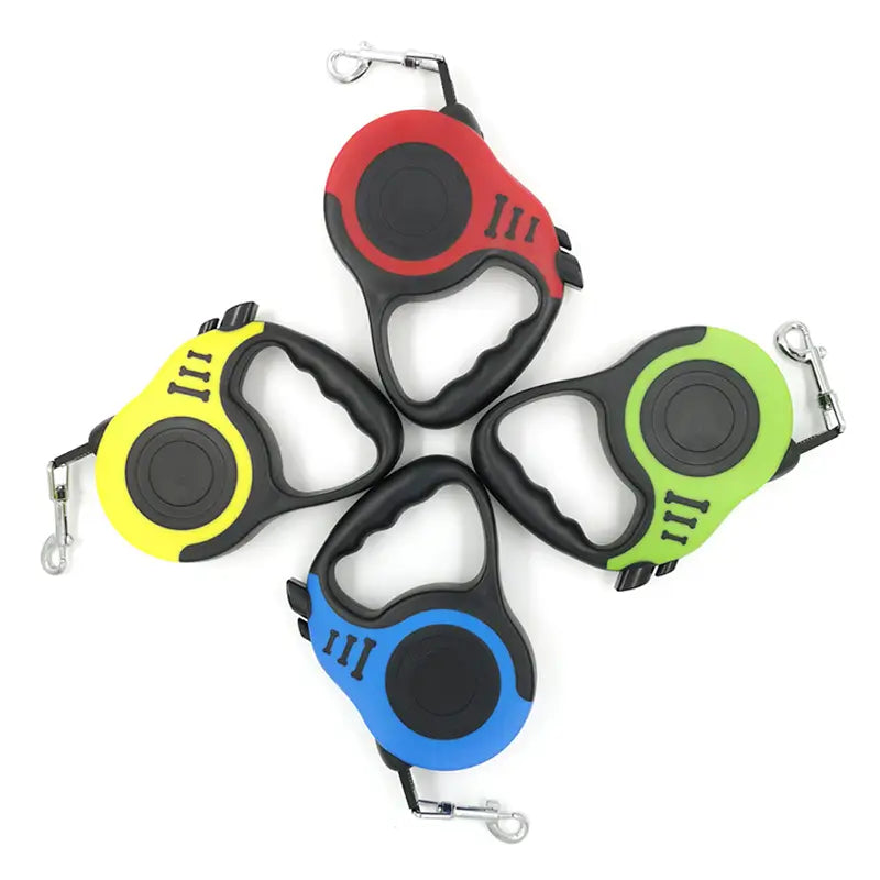 Four retractable dog leashes in vibrant red yellow green and blue with black accents featuring a one touch locking system for secure and convenient leash control.