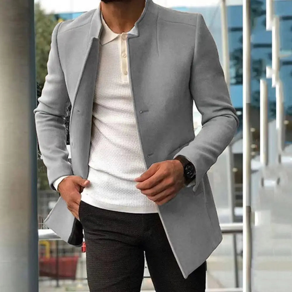 Light gray tailored mens slim fit solid color overcoat with a structured fit and notched lapels.