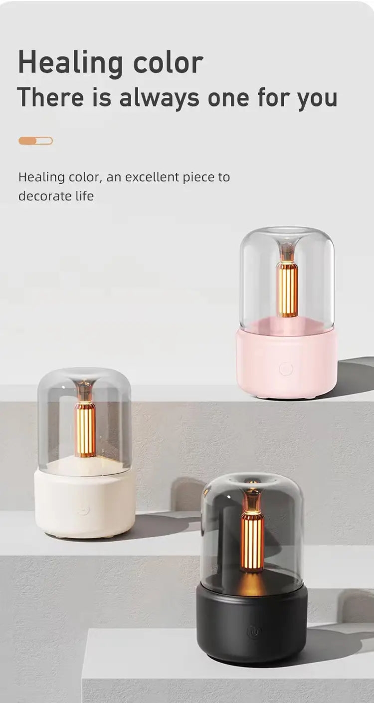 Minimalist cylindrical table lamp with a clear glass dome, gold-toned central column, and base available in soft pink, creamy white, or matte black designed as a candlelight aroma diffuser USB mist humidifier 120ml.