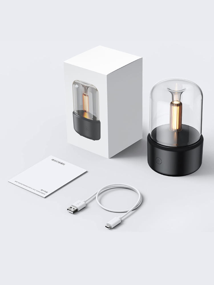 black cylindrical candlelight aroma diffuser usb mist humidifier with clear glass dome housing a golden filament bulb and 120ml capacity