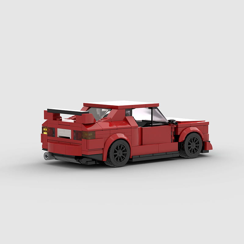 Rotes Sportwagen-Bausteinset M10386 mit einem roten LEGO-Modell mit schwarzen Rädern und einem Spoiler.