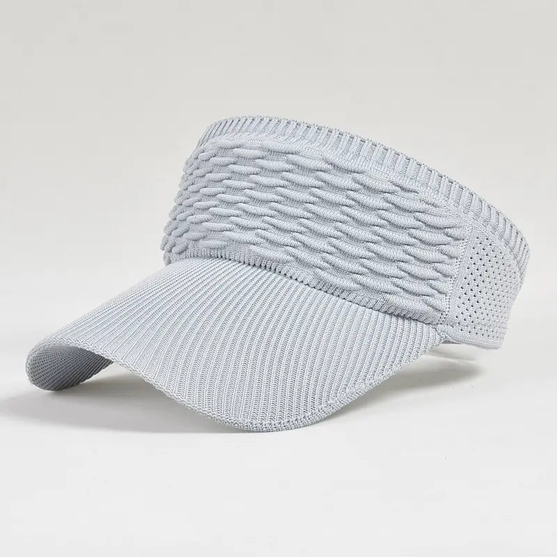Light gray knitted visor cap with a textured woven pattern and breathable mesh side panels designed for summer sports and headband use.