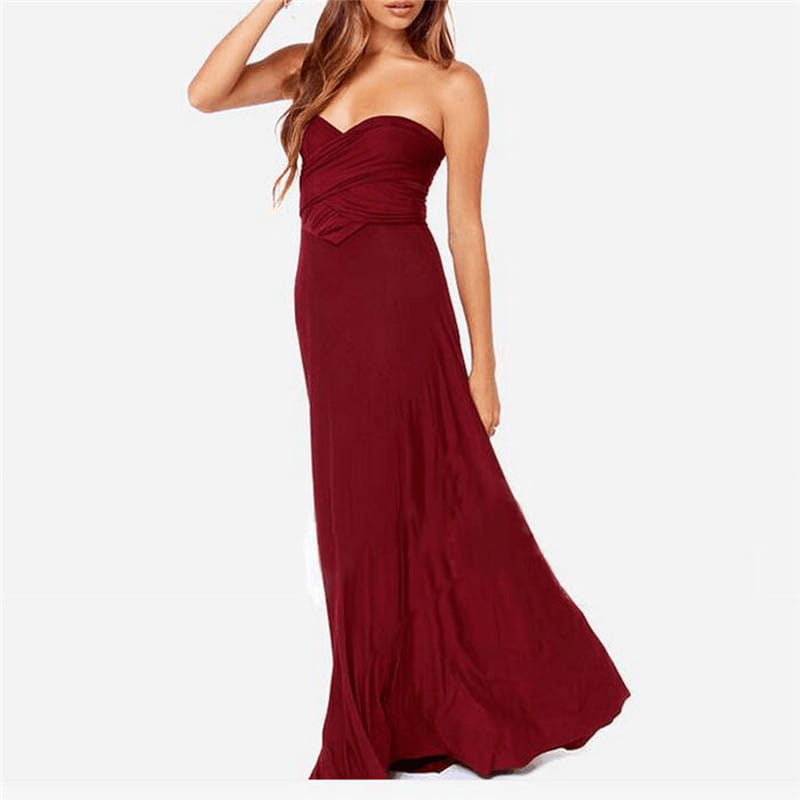 A flowing strapless maroon maxi dress with a ruched bodice and a subtle bow detail at the waist featured in a women’s boho multiway halter neck flowing maxi dress product.