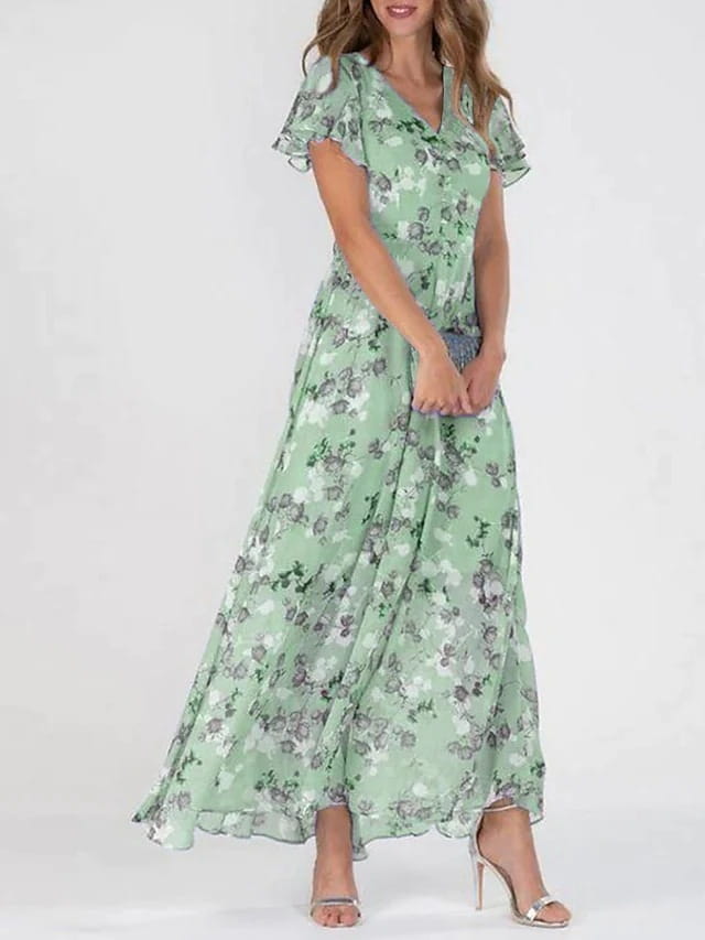 Une robe longue d’été fluide vert menthe avec un décolleté en V, un motif floral délicat et des manches courtes volantées