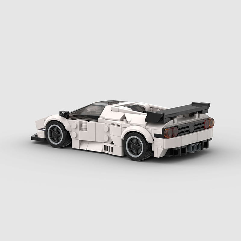 Lego Technic sports car model Diablo GT building blocks featuring a white and black lego race car with a sleek aerodynamic design and prominent rear spoiler seen from the back side.
