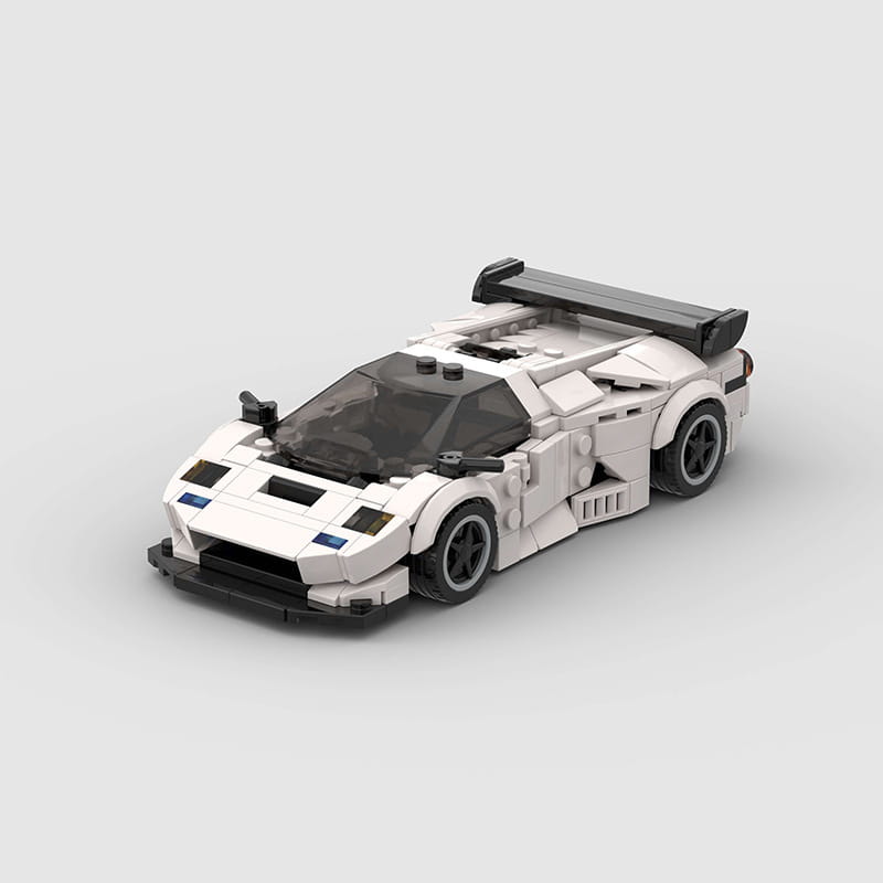 White and black Lego Technic Sports Car Model Diablo GT race car with a sleek aerodynamic design featuring a prominent rear spoiler made from building blocks.