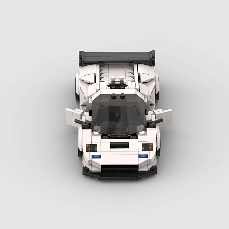 White and black Lego Technic sports car model Diablo GT building blocks featuring a sleek aerodynamic design with an open cockpit and prominent rear spoiler.