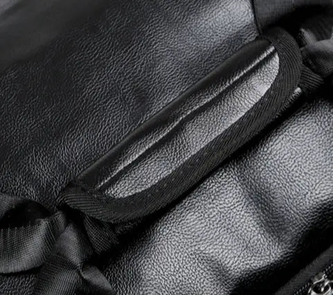 Black leather shoulder strap with reinforced stitching and subtle sheen on men’s pu leather travel duffel bag 20-35l capacity.