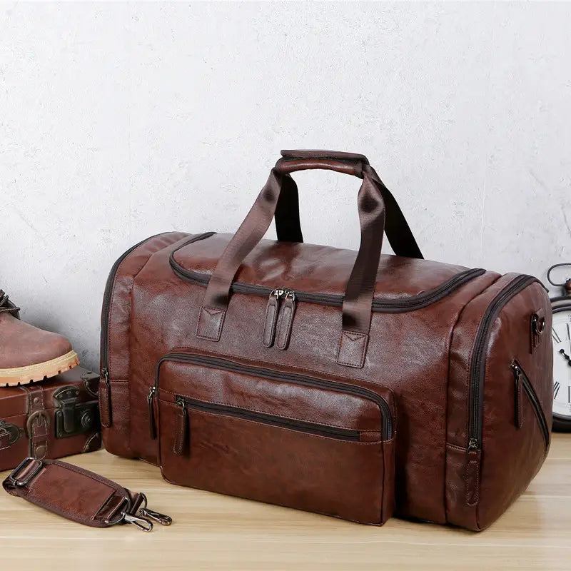 Brown leather men’s pu leather travel duffel bag with multiple zippers and a top handle featuring 20-35l capacity.