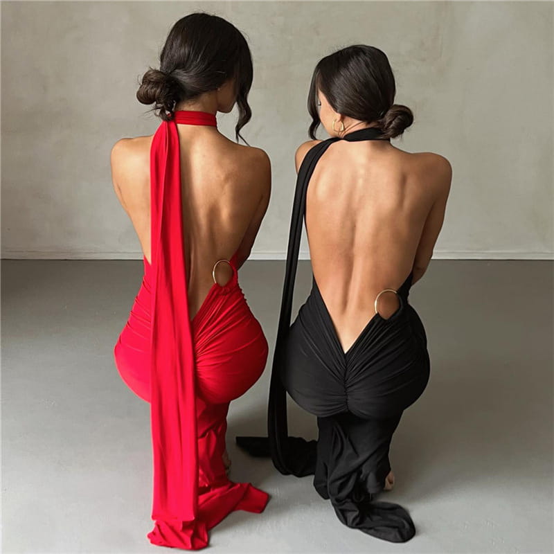 red and black halter-neck backless one shoulder mermaid train dresses with flowing fabric ties shown from the back.