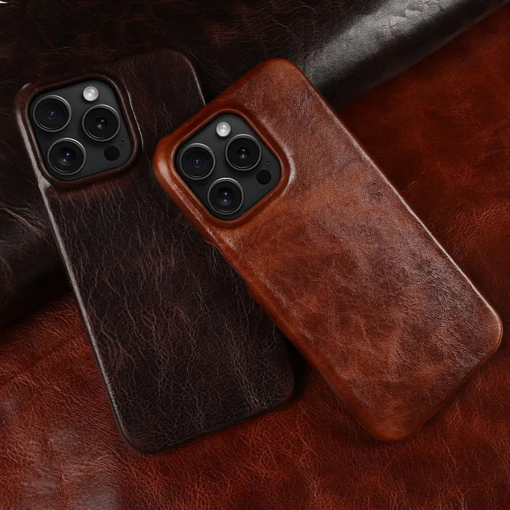 Two leather iphone cases in rich brown and deep chocolate brown with a textured vintage horse oil drop resistant surface shown from the back side.