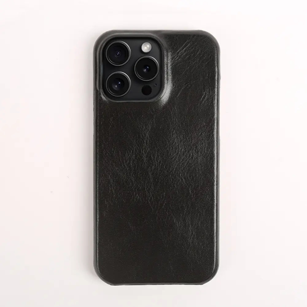 Black faux leather leather iPhone case vintage horse oil drop resistant shown from the back with a textured surface and precise cutout for the camera module.
