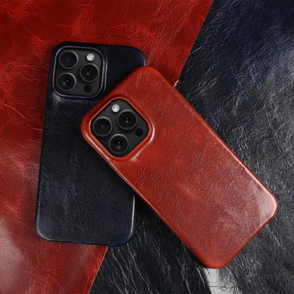 Red and black leather iPhone cases with a textured vintage horse oil finish shown from the back side and designed to be drop resistant