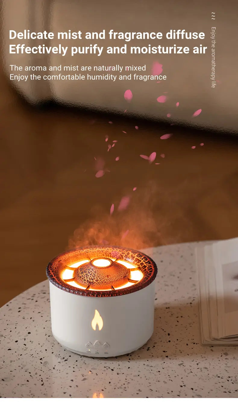 White cylindrical volcano flame diffuser jellyfish air humidifier with glowing flame design and textured amber-lit top emitting delicate pink mist.