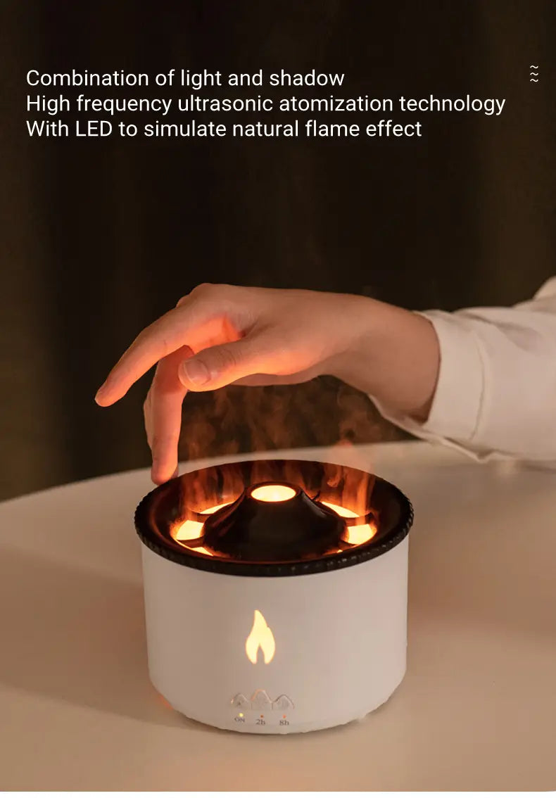 White cylindrical Volcano Flame Diffuser Jellyfish air humidifier with a black rim and LED flame effect.