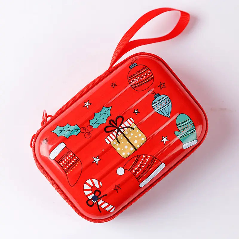 Festive christmas and galaxy tinplate zippered coin purse in red with a glossy finish featuring cartoon christmas ornaments mittens stockings candy canes and holly printed in teal white gold and red.