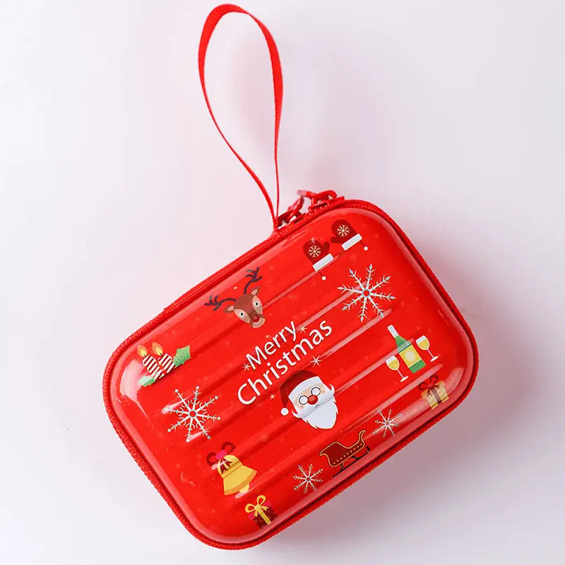 red christmas-themed tinplate zipper coin purse with festive illustrations and a matching red loop handle