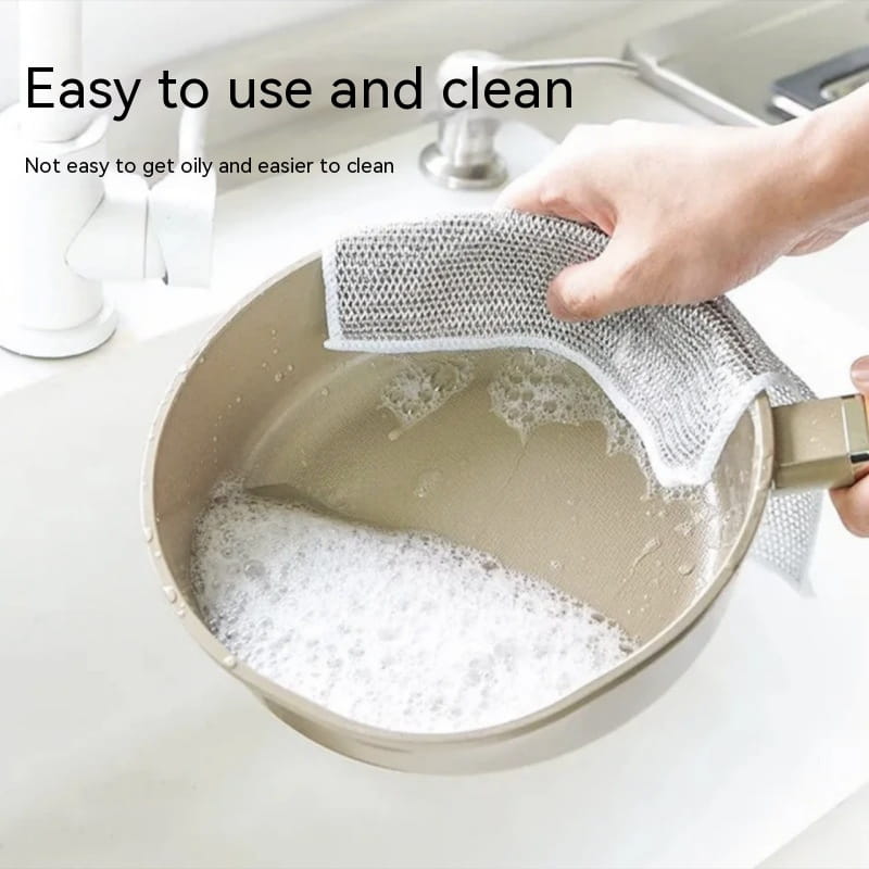 gray steel wire dishcloth mesh kitchen scrubber with white border cleaning a pot in soapy water 20x20cm