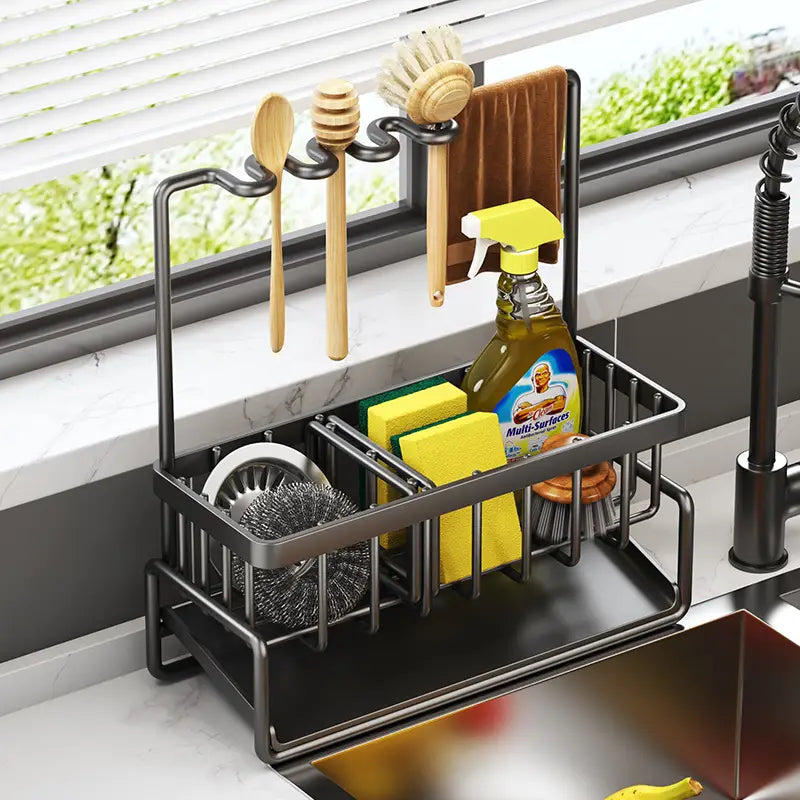 Black metal kitchen sink storage rack stainless steel organizer with multiple compartments and hooks for utensils sponges and cleaning tools.