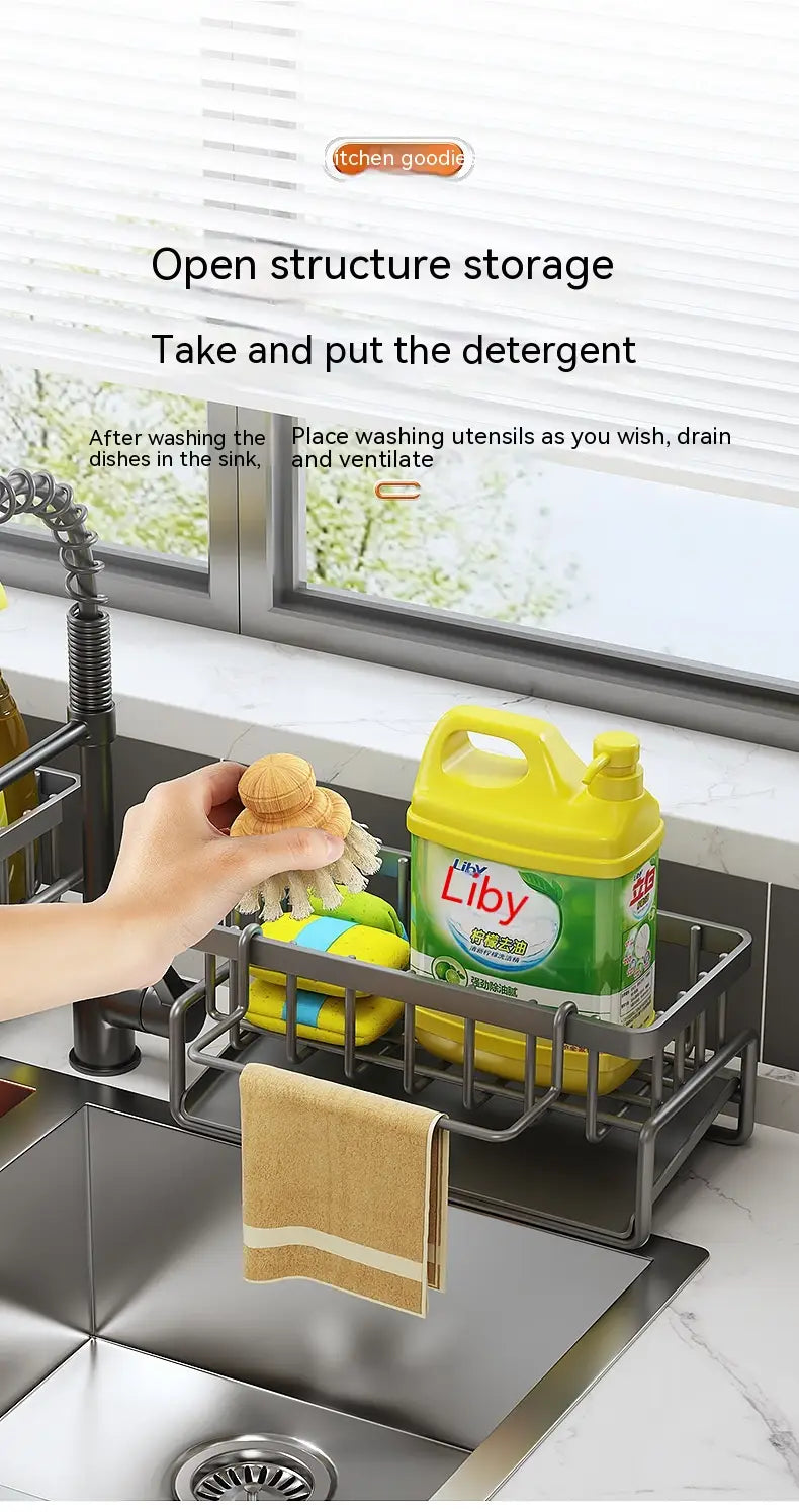 Black metal kitchen sink storage rack with open structure design made of stainless steel holding a yellow detergent bottle and cleaning brushes.