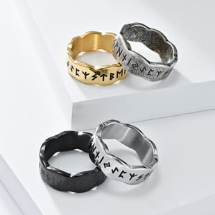 Vintage Caesar portrait stainless steel signet rings featuring gold and silver metal with rune engraving and black textured accents.