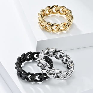 Vintage Caesar portrait stainless steel signet rings in gold and black chain-link design displayed on a white surface.