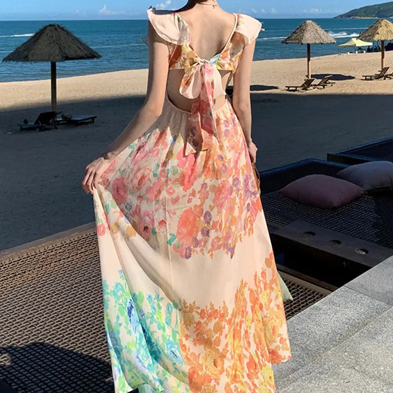 a flowing backless floral maxi dress in soft peach and pastel hues with a delicate ruffled neckline titled french floral v neck ruffle maxi dress