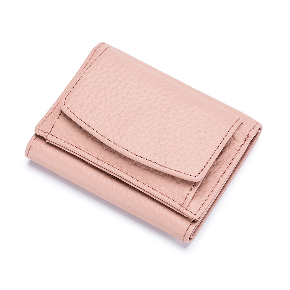 A soft pink textured leather mini trifold wallet with neat stitching along the edges made from compact cowhide for card holding.