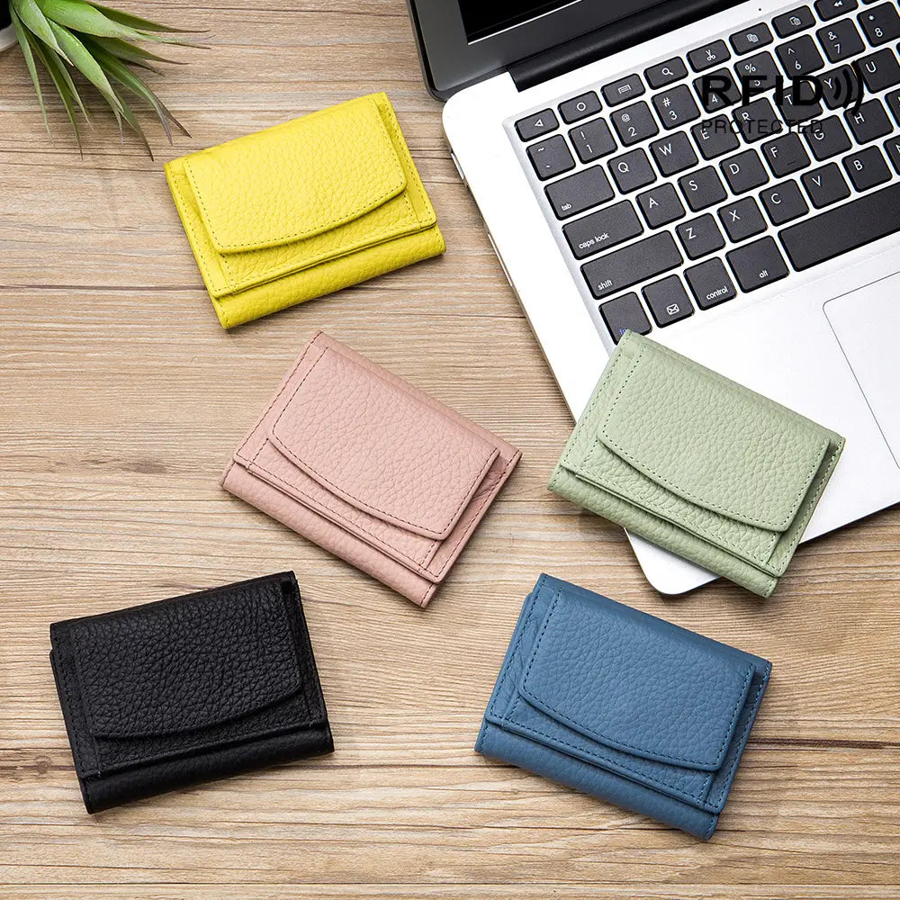 Yellow textured leather tri-fold wallet made of cowhide with compact bifold design for card holding.