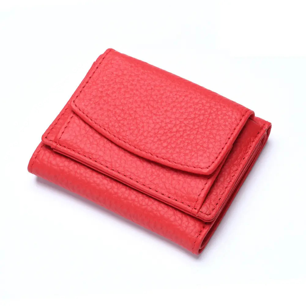 Vibrant red textured leather mini wallet compact cowhide bifold card holder with neat stitching and sleek compact design.