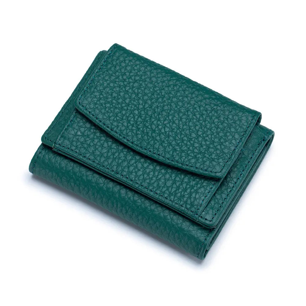 A compact dark green cowhide leather mini trifold wallet with pebbled texture and precise stitching designed as a bifold card holder.