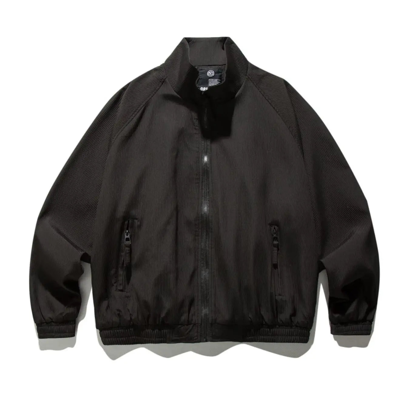 Black corduroy bomber jacket with ribbed cuffs and hem featuring a retro loose fit and zipper closure.